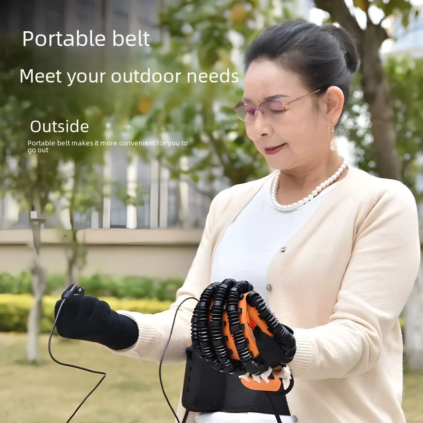 Senior woman using rehab glove with portable belt outdoors for stroke recovery therapy