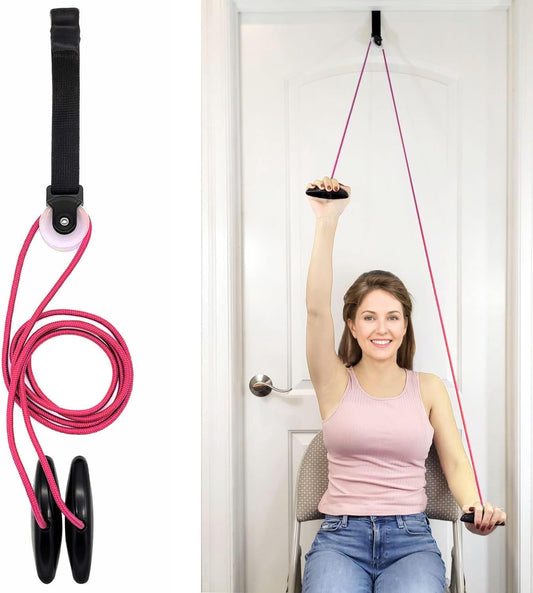 Over-the-door shoulder pulley exercise system for arm rehab and mobility, woman using it seated
