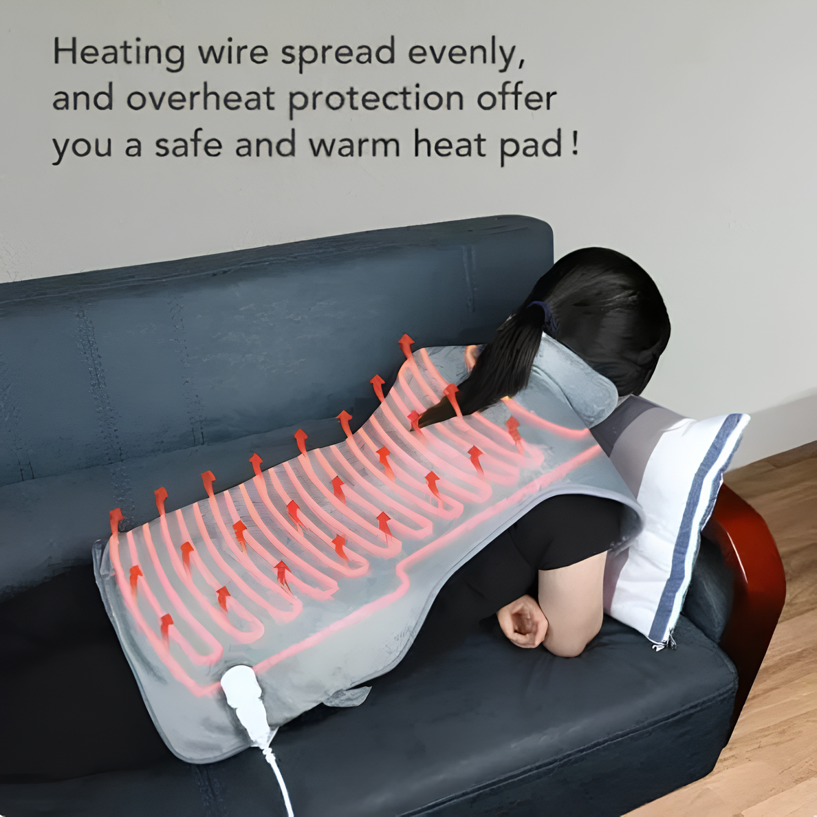 Woman using electric heat therapy pad for back and neck pain relief on a couch